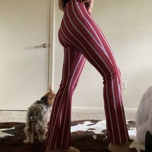 Red pants with black white and yellow stripes